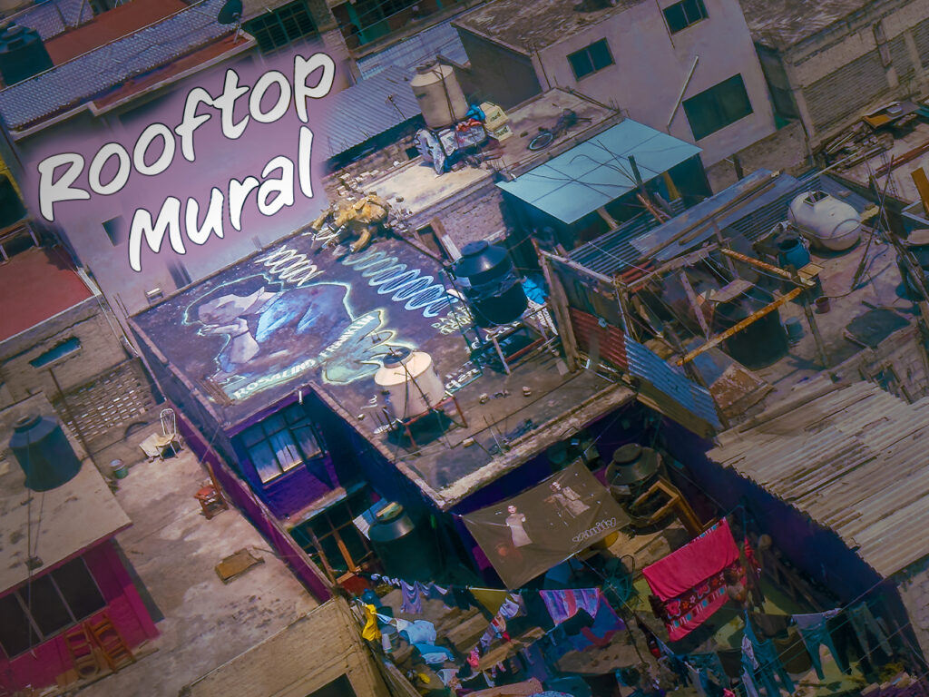 View of a rooftop mural from the cable car