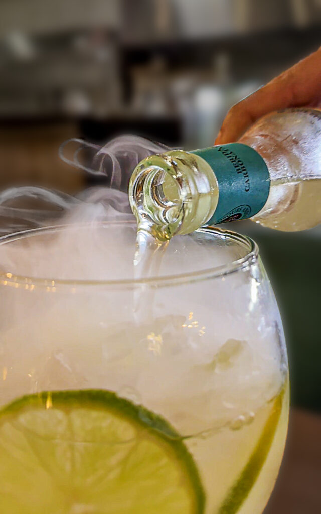 Cloud of smoke rising from a dry-ice Gin & Tonic