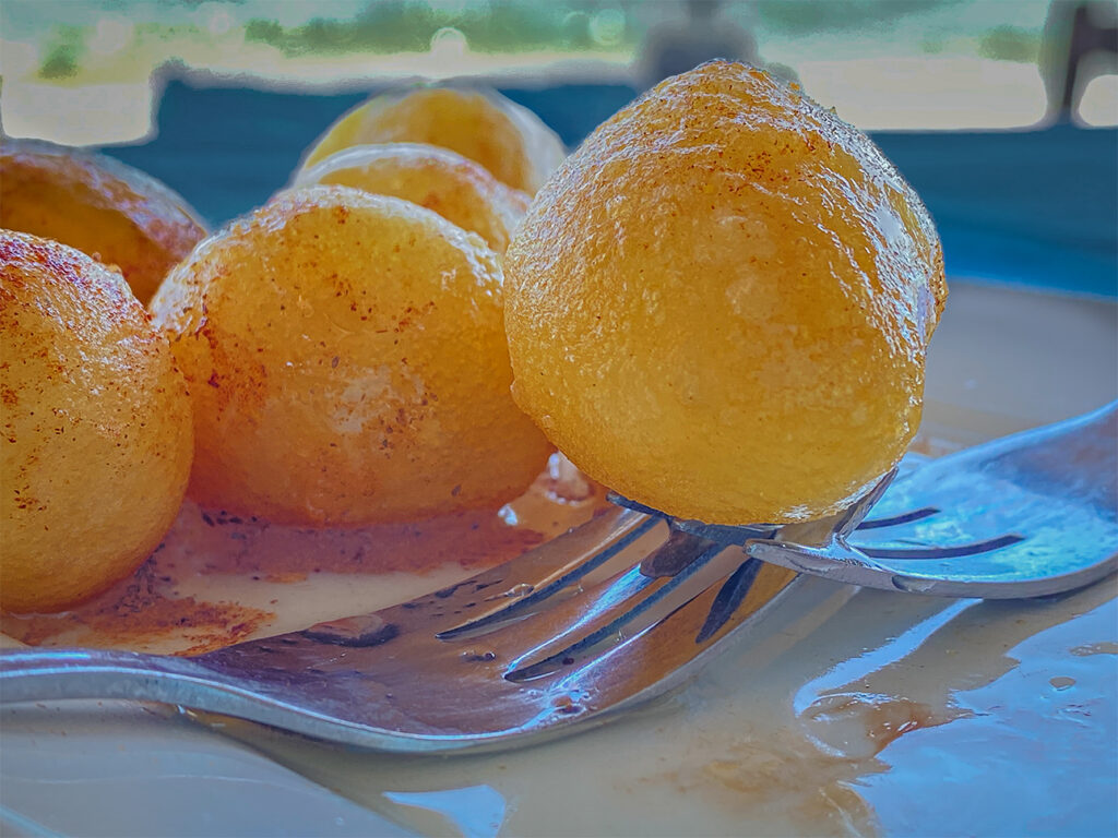 Delicious honey-covered Loukoumades (donuts) in Greece